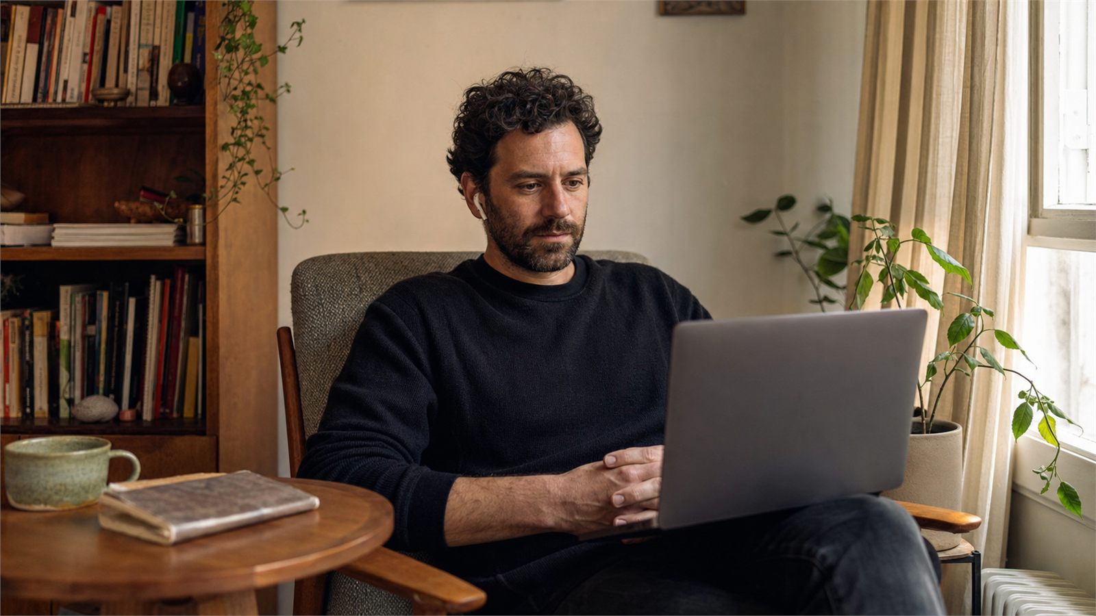 Adult client attending a private online therapy session from a lived-in home